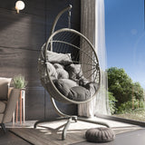 Stylish egg hanging chair outdoor with a grey cushion and sturdy frame for garden relaxation.