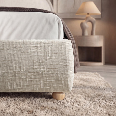 [King | Beige] Low-profile base detail with crosshatch woven fabric and natural oak round leg