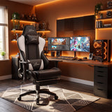 [Black + White] Ergonomic Gaming Chair with Footrest positioned at a gaming desk with warm ambient lighting.