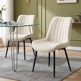 [Beige | Set of 2] Fabric dining chair beside a glass table, showing vertical stitching and black metal legs