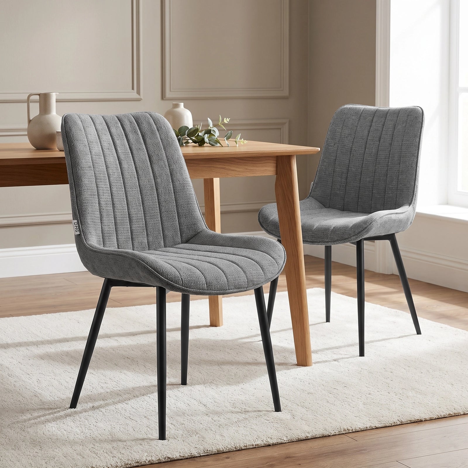 [Grey | Set of 2] Two fabric dining chairs beside a table, showing curved backs and slim black metal legs