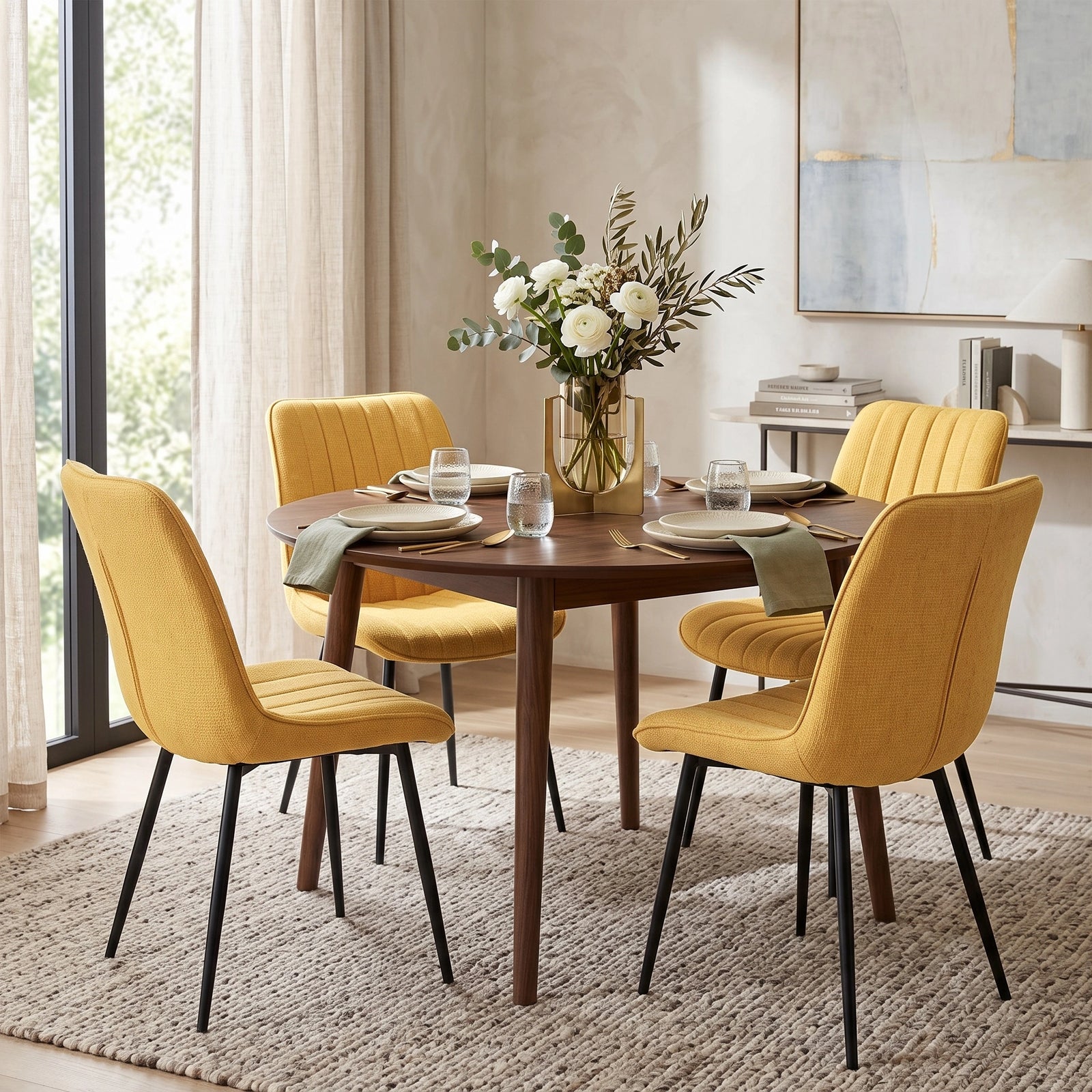 [Mustard | Set of 2] Four fabric dining chairs around a round table in a bright dining room