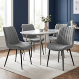 [Grey | Set of 4] Four fabric dining chairs around a round table in a room with a blue feature wall