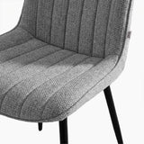 [Grey | Set of 4] Close-up of fabric dining chair seat and back showing textured vertical stitched padding