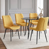 [Mustard | Set of 4] Four fabric dining chairs around a black round table in a neutral dining room