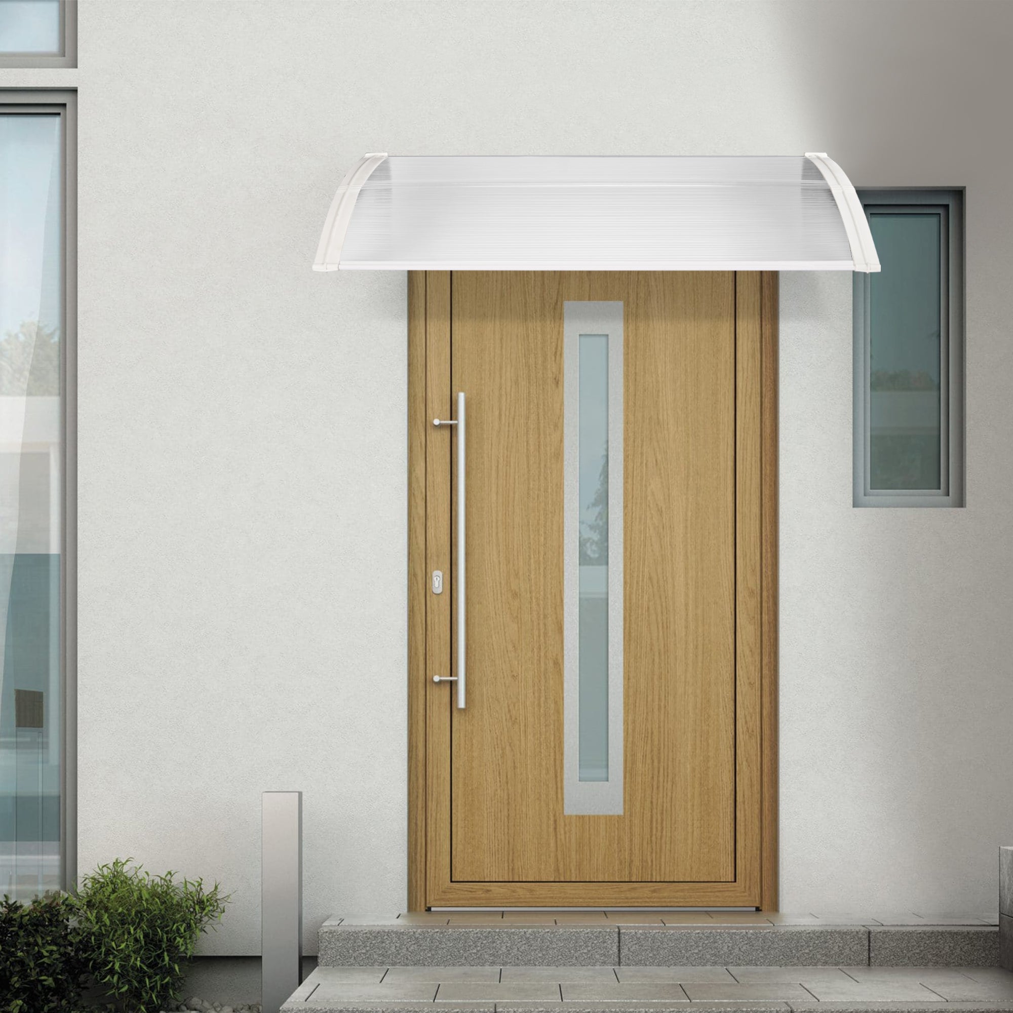 Flat door canopy with a modern design, featuring a curved clear panel and sturdy black brackets,