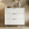 [White] Flutrina 3 drawer chest with vertical ribbed fronts, stone bowl and tall vase resting on top