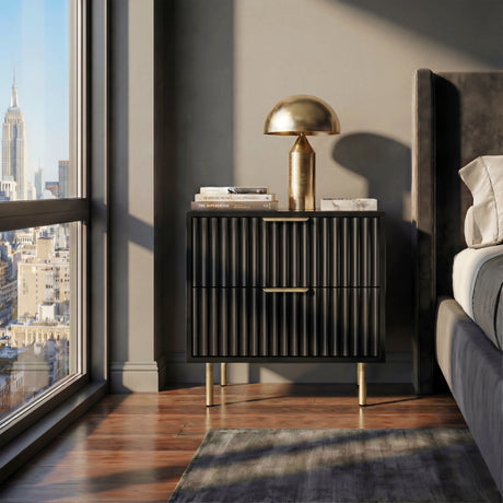 Black nightstand unit with two drawers in flutrina design placed against a wall in a bedroom setting