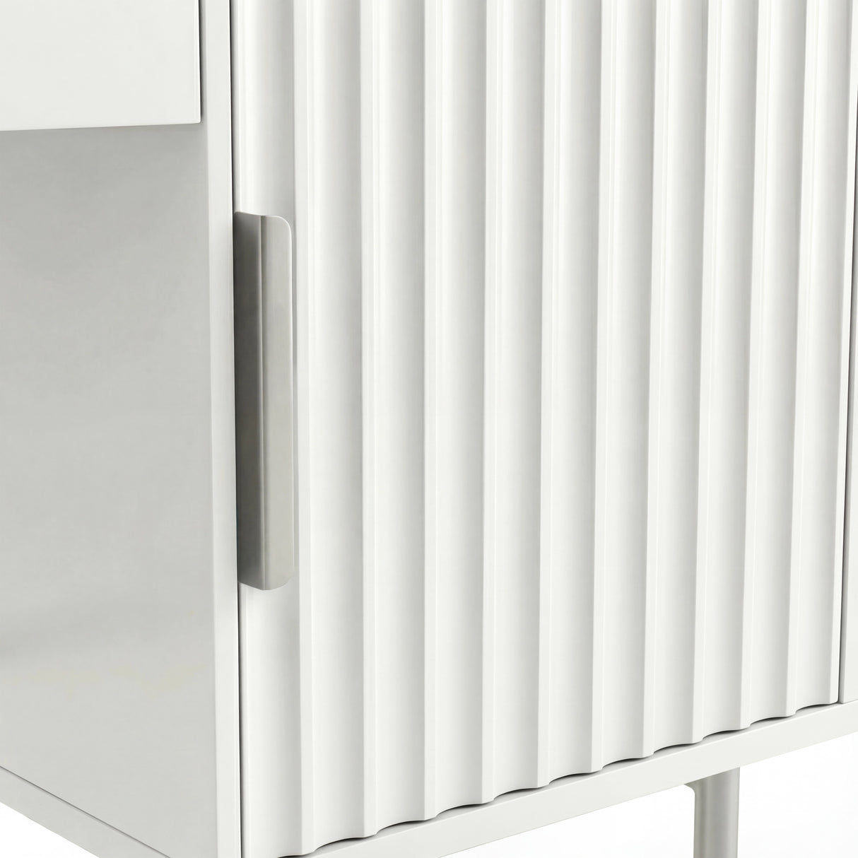 Close-up of a white flutrina vanity table with a modern, minimalist design and a silver handle on the drawer