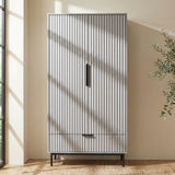 [Grey] painted 2 door wardrobe with drawer storage positioned in neutral room interior with natural bright lighting