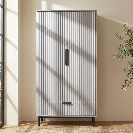 [Grey] painted 2 door wardrobe with drawer storage positioned in neutral room interior with natural bright lighting