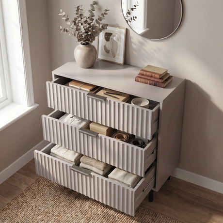 [Grey] chest of drawers opened to reveal internal storage layout across three levels with black metal handles