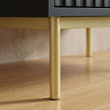 Black wardrobe three door cabinet raised on golden finish metal legs with sturdy lower frame construction