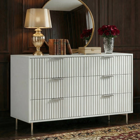 White flutrina 6 drawer chest with silver metal legs positioned in bedroom interior with styled decor