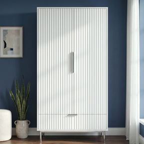 [White] Flutrina 2-door fluted wardrobe in a bedroom lifestyle setting showing full height and door detail