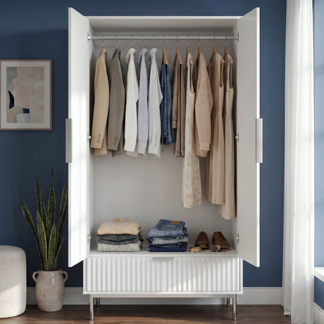 [White] Flutrina 2-door fluted wardrobe in a styled bedroom with neutral tones and soft furnishings around