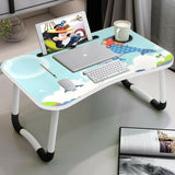 Folding table for laptop with whale design, featuring a cup holder and device slots.