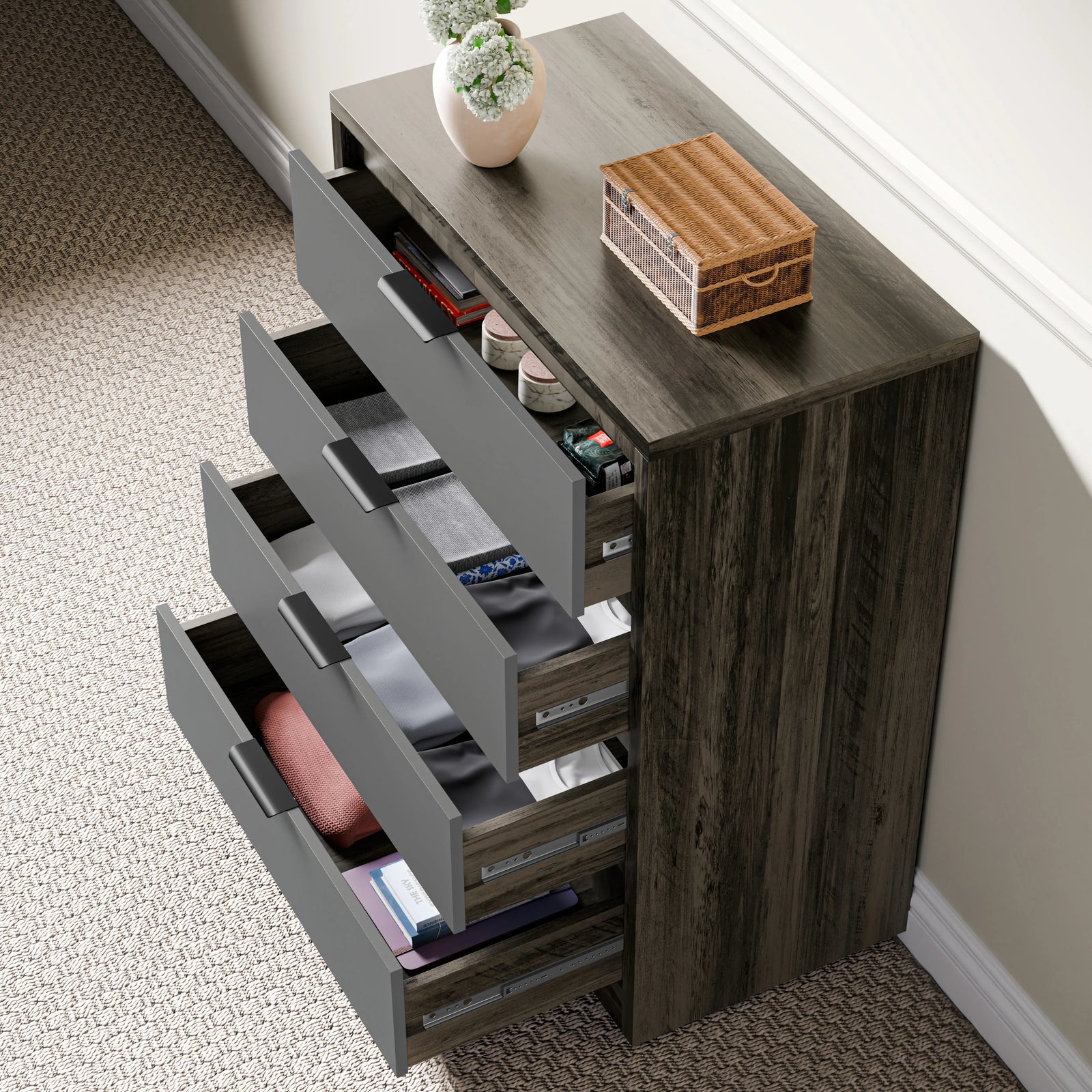 [Wooden Grey+Grey] Four drawer chest of drawers in wooden grey finish with partially open drawers placed against a wall