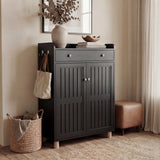 Modern hallway storage unit with slatted pattern detailing and a slim profile placed beside soft furnishings