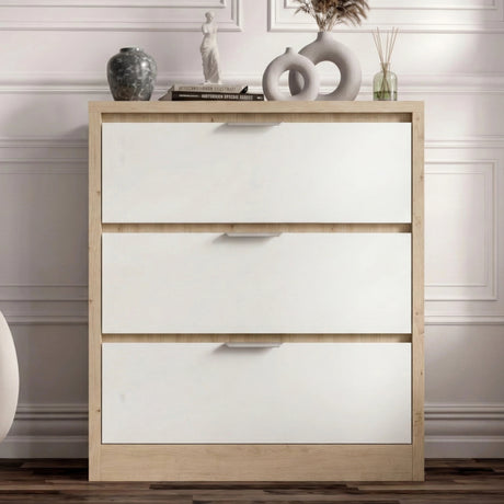 Straight-on view of the Skova chest of drawers, detailing its modern dual finish with a wood frame and white drawers