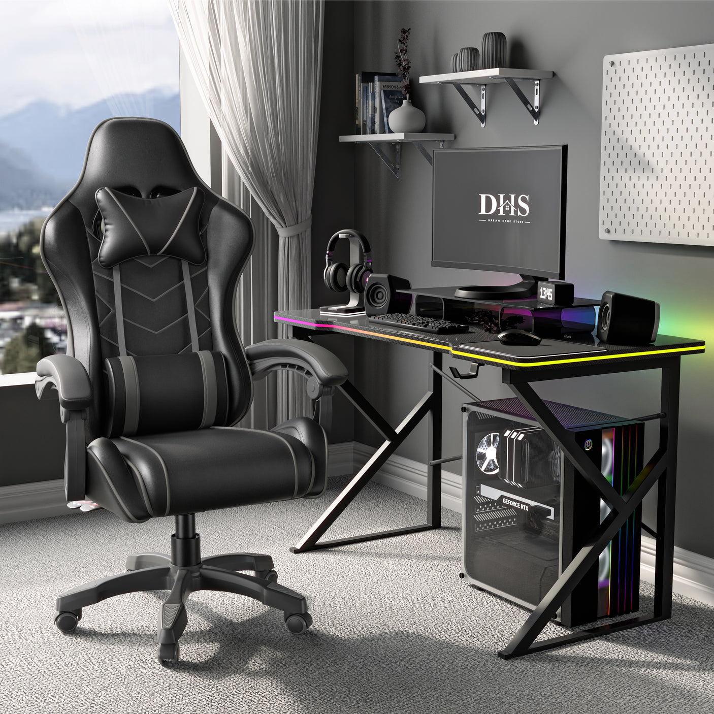 Gaming desk setup with a black and Grey  chair, monitor, and computer components in a room with large windows.