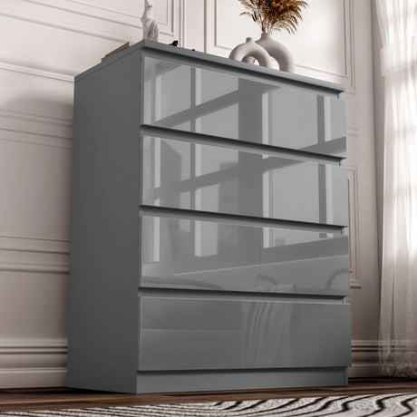 Dark grey high-gloss dresser with four drawers in a room setting.