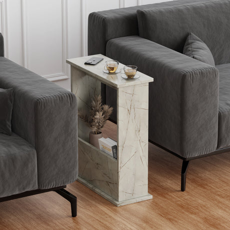 side table for living room between two sofas, gold veins top with magazine in holder and cup of coffee on surface.