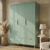 Green three door wardrobe with integrated drawers placed in a contemporary room setting with natural lighting