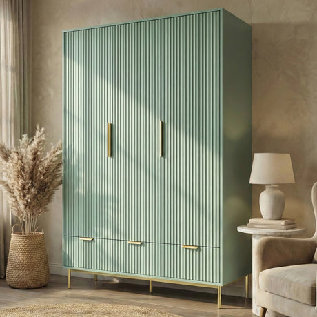 Green three door wardrobe with integrated drawers placed in a contemporary room setting with natural lighting