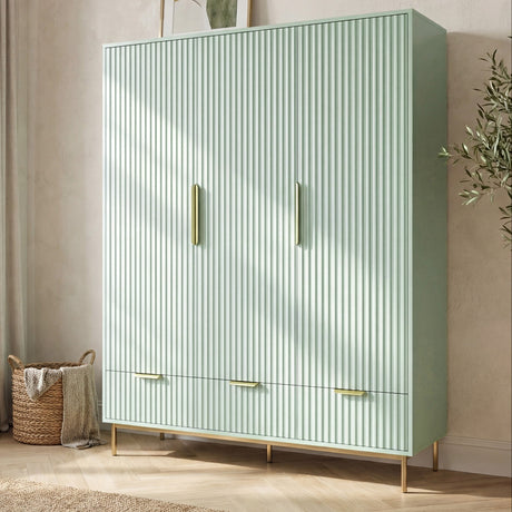 [Sage Green] three door wardrobe with integrated drawers placed in a contemporary room setting with natural lighting