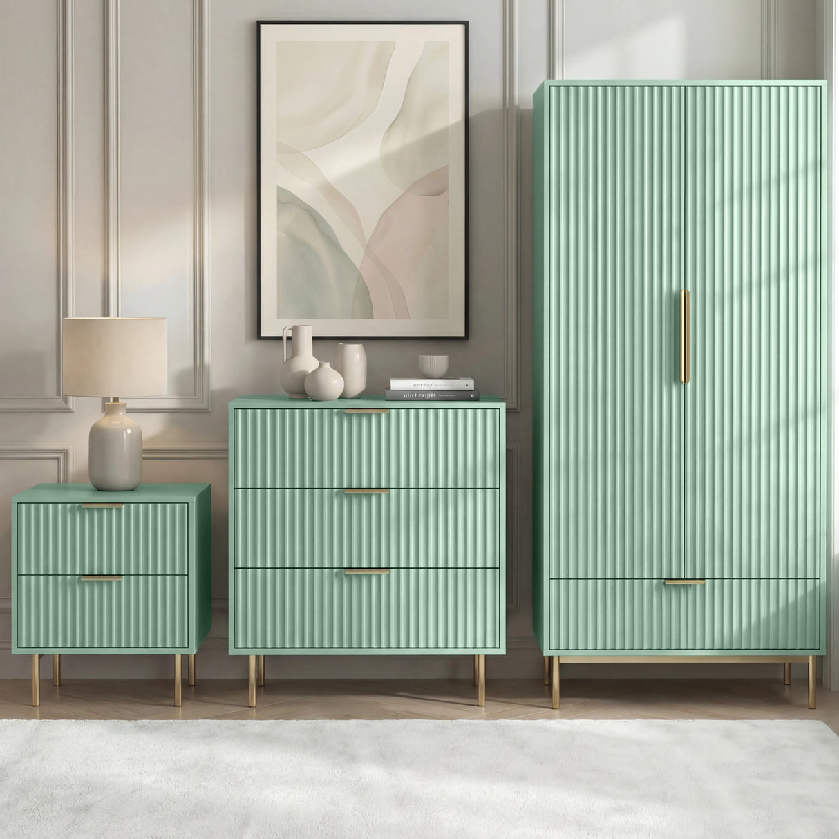 Green three-piece matching flutrina design bedroom set, including a wardrobe, chest of drawers, and bedside table