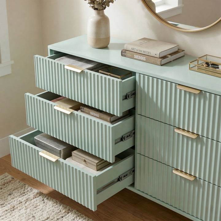 [Sage Green] painted chest with three drawers extended, highlighting internal storage layout with metallic smooth runner hardware