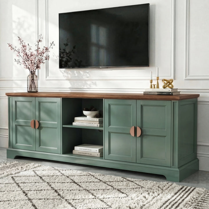 [Green | 170cm] Bellford TV unit from a low side angle on a light floor with cherry blossom vase and wall-mounted TV
