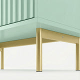 Green three chest of drawers' lower section highlighting golden legs and elevated frame design