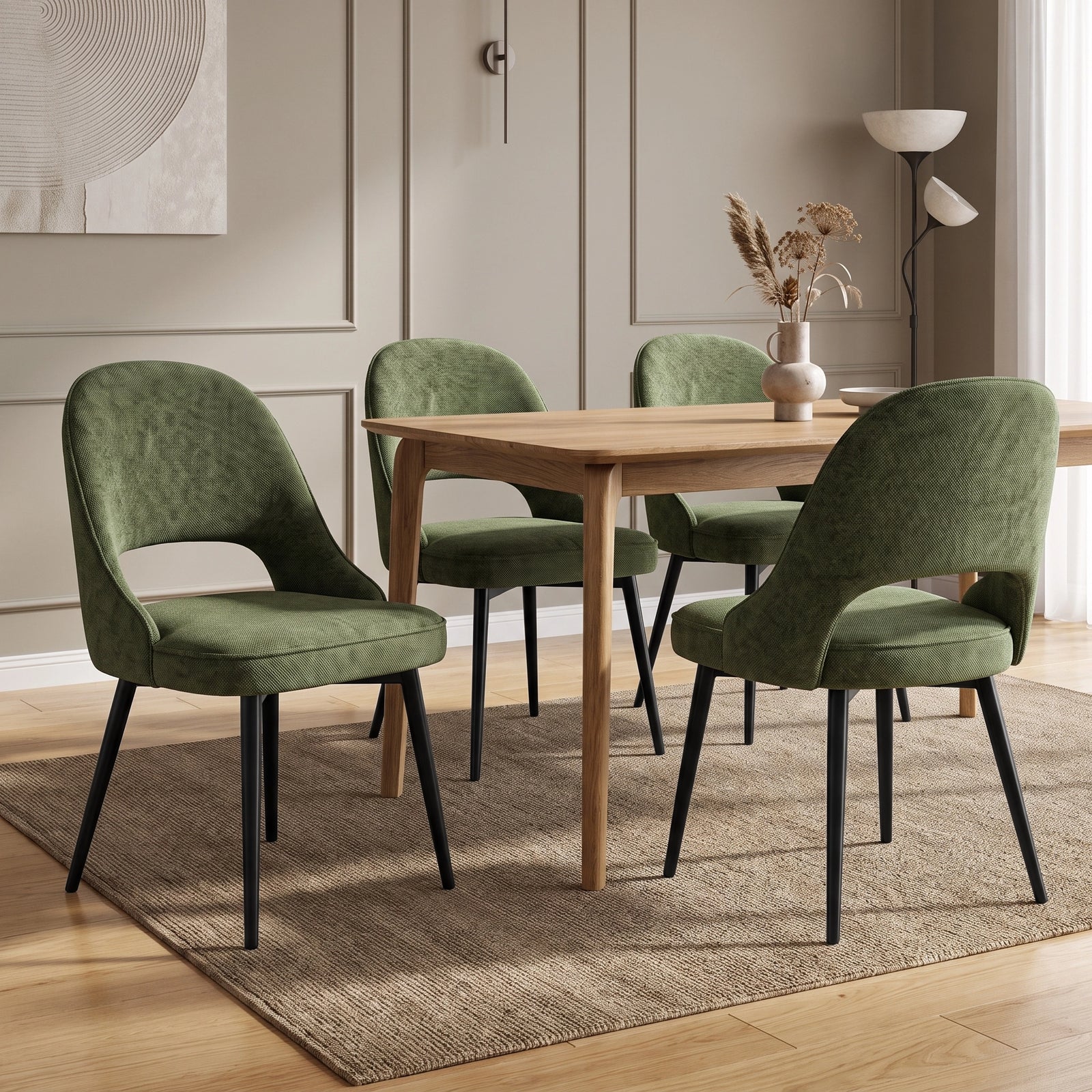 [Set of 4  | Green] Four curved-back dining room chairs with piped seats and black legs arranged around a light wood table.