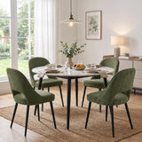 [Green | Set of 2] Two pairs of the comfy dining chairs around a round marble-effect table styled with fruit and eucalyptus.