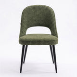 [Set of 4 | Green] Front view of the comfy fabric dining chair with rounded open back, piped seat and four black metal legs.