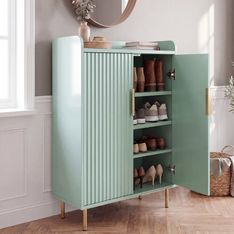 [Green] Fluted Green Painted 5 Tier Shoe Storage with one door open, ribbed front, shoes on shelves, brass legs