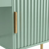 A close-up of a green flutrina vanity dressing table with a sleek golden handle and smooth texture