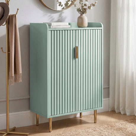 [Green | 60cm] Flutrina shoe cabinet in a hallway with fluted doors closed, coat stand on the left, sheer curtain behind