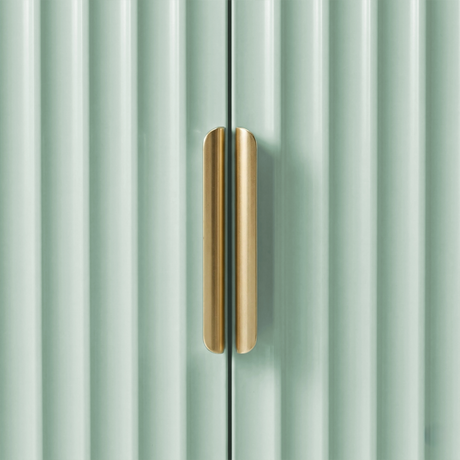 [Green] Flutrina shoe cabinet close-up of the split gold bar handle bridging two ribbed cabinet doors in sage green