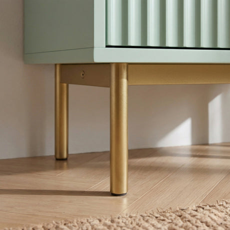 [Green | 60cm] Flutrina close-up of brushed gold legs and base frame beneath the green cabinet on a wooden floor