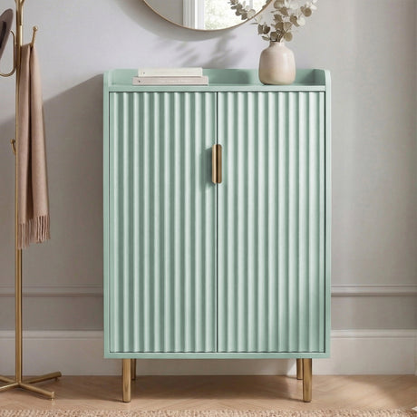 [Green | 60cm] Flutrina shoe cabinet from a slightly wider hallway angle with doors closed and a vase on the top shelf