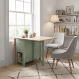 [Green] Stovra Drop Leaf Dining Table with one leaf open styled as a small dining table beside two grey chairs