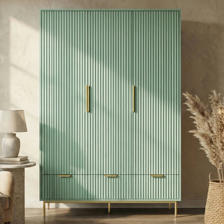 Front perspective of green 3 door wardrobe with coordinated drawer storage below and golden metal legs