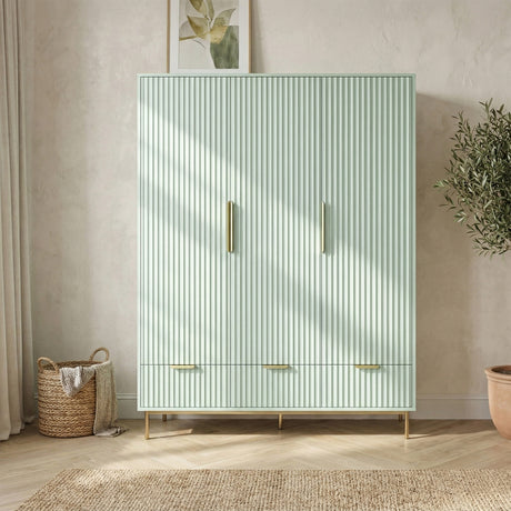 [Sage Green]  Front perspective of green 3 door wardrobe with coordinated drawer storage below and golden metal legs