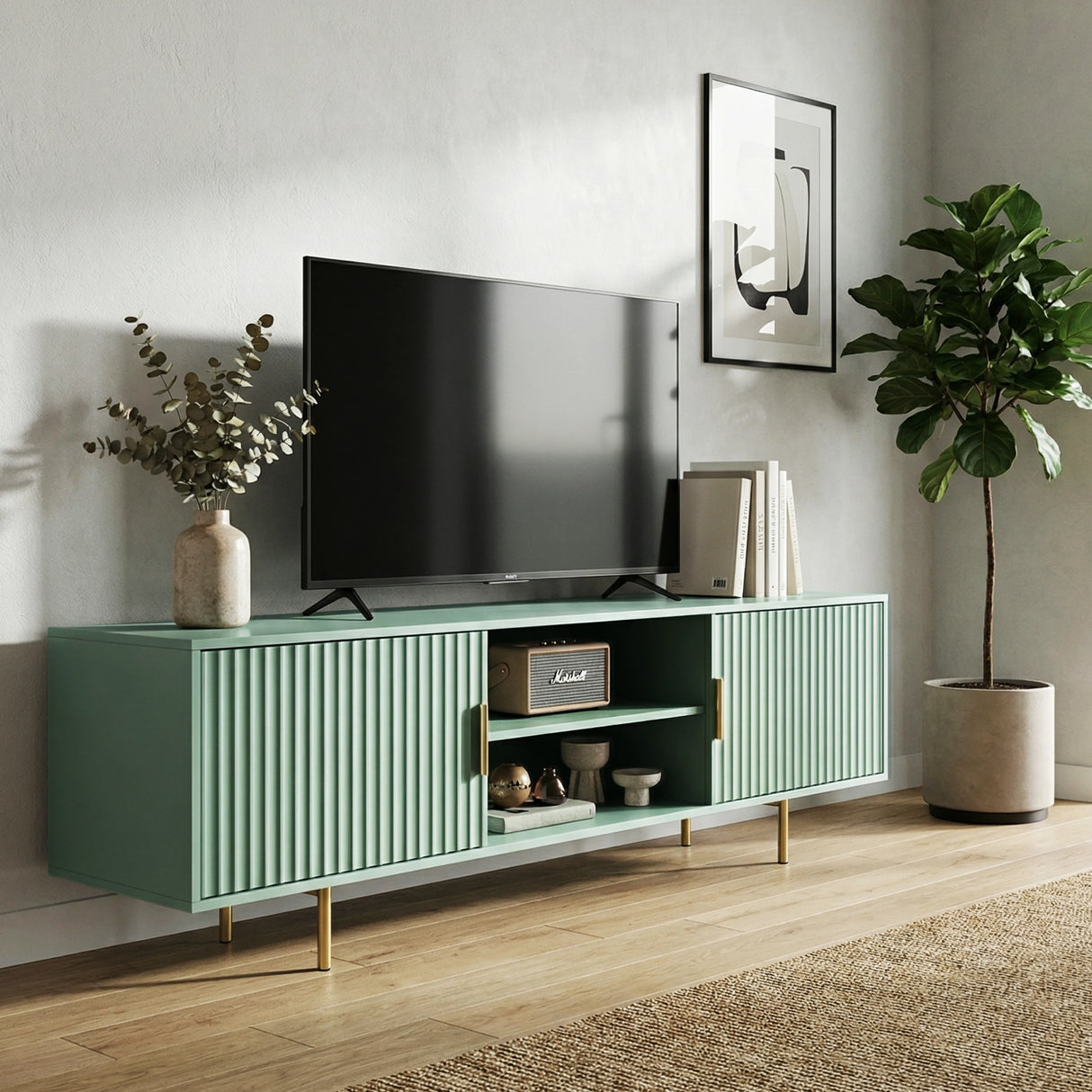 Green TV stand with vertical fluted doors and silver legs, providing a modern storage solution for colorful interiors.