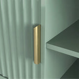 Green TV stand with open shelving and fluted cabinets for media components, finished with gold colour handles.