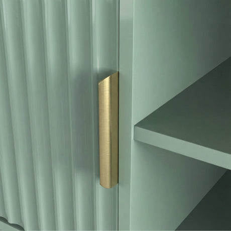 Green TV stand with open shelving and fluted cabinets for media components, finished with gold colour handles.