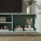 Green TV storage stand with open shelves and fluted doors, perfect for organizing media consoles and decor.
